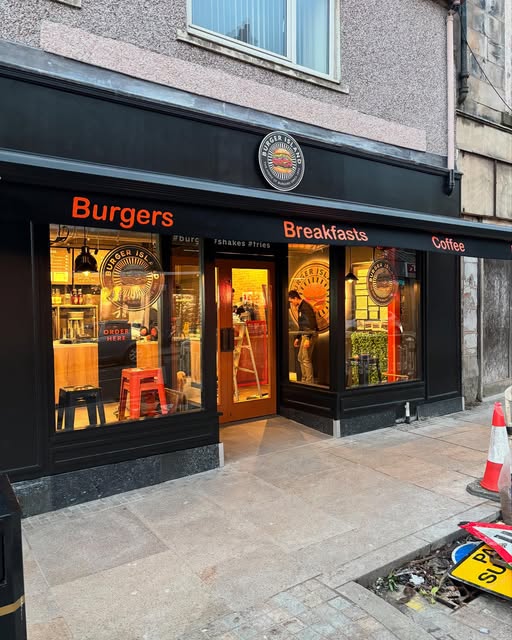 Burger Island shopfront repaint in black with bold signage