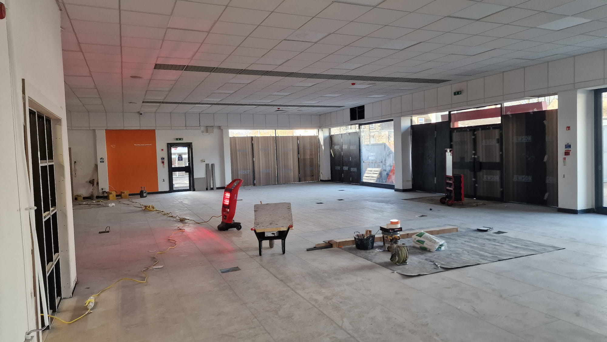 Large commercial showroom during interior painting work